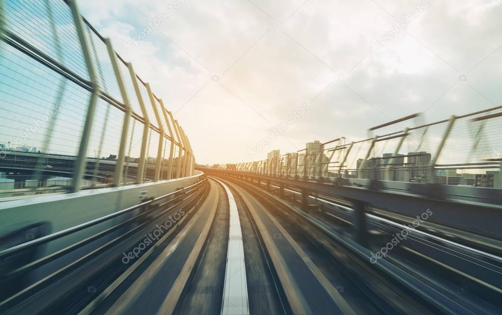 Train moving on city rail with motion blur