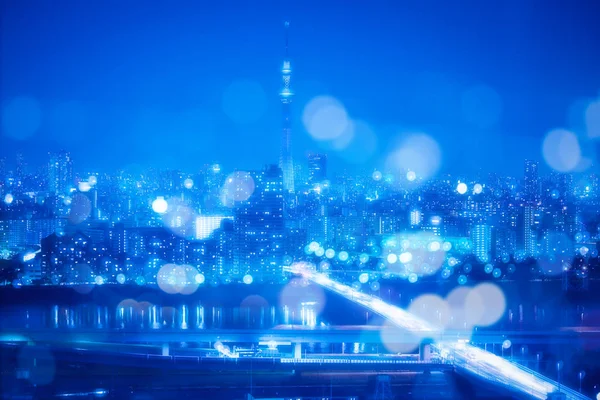 Tokyo City natt bakgrund med oskärpa Bokeh lampor — Stockfoto