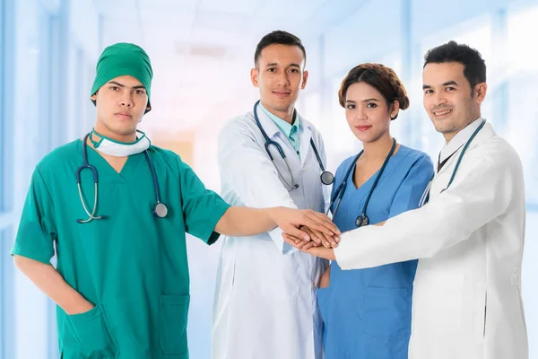 Doctors group, surgeon and nurse on hospital background