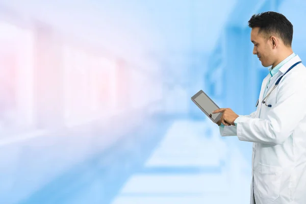 Male Doctor Working on Tablet Computer