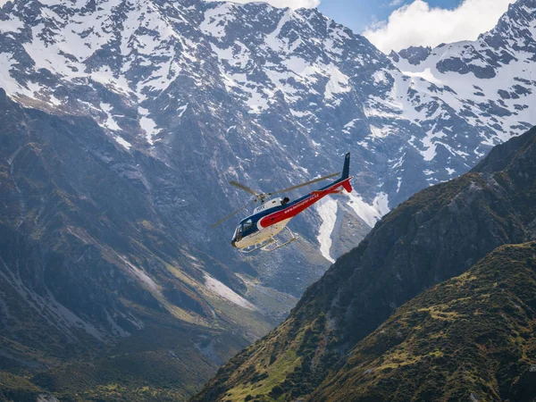 Helicopter flys in the mountain area — Stock Photo, Image