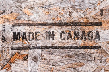 Kanada metin geri dönüştürülmüş ahşap tahta üzerinde yapılan