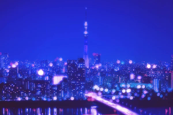 Tokyo şehir gece arka plan bulanıklık Bokeh ışıklar ile — Stok fotoğraf