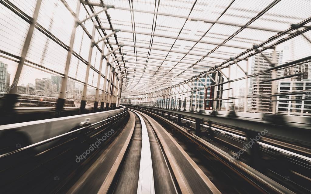 Train moving on city rail with motion blur