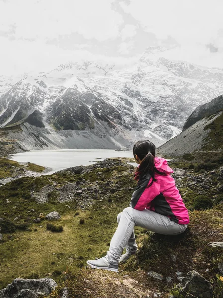 Mountain hiker traveling in wilderness landscape.