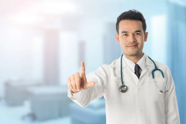 Male doctor pointing finger at copy space. — Stock Photo, Image