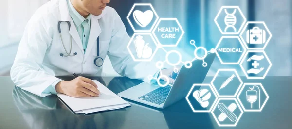 Medical concept - Doctor on Computer with Icons — Stock Photo, Image