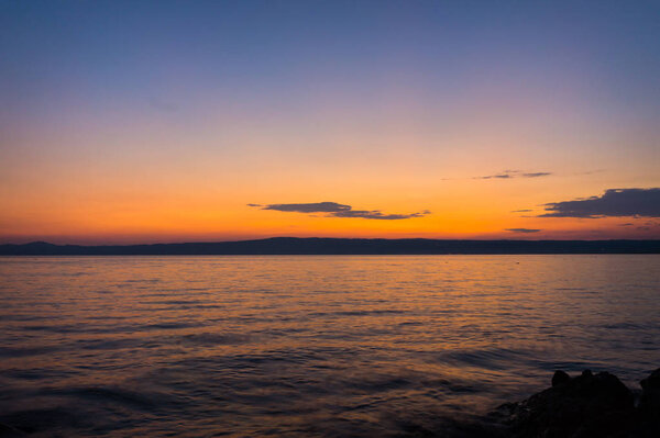 Sunset or sunrise at ocean beach landscape.