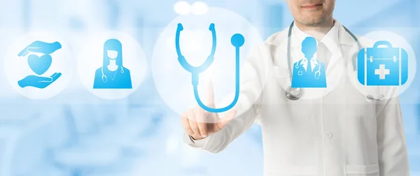 Doctor points at stethoscope with medical icons. — Stock Photo, Image