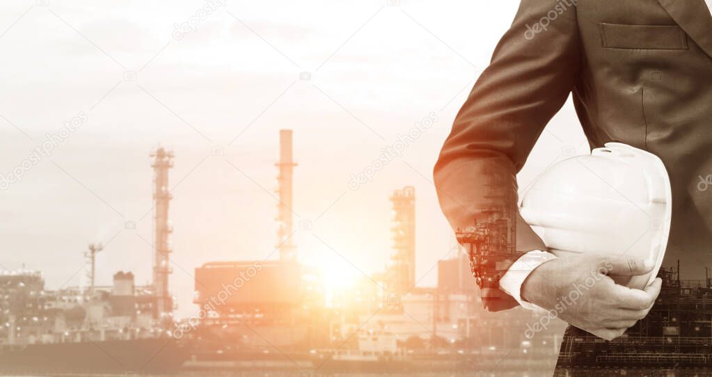 Future factory plant and energy industry concept in creative graphic design. Oil, gas and petrochemical refinery factory with double exposure arts showing next generation of power and energy business.