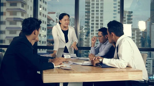 Asian business people discuss marketing strategy in group meeting at modern office. Business finance and teamwork concept.;Asian business people discuss marketing strategy in group meeting at modern office. Business finance and teamwork concept.
