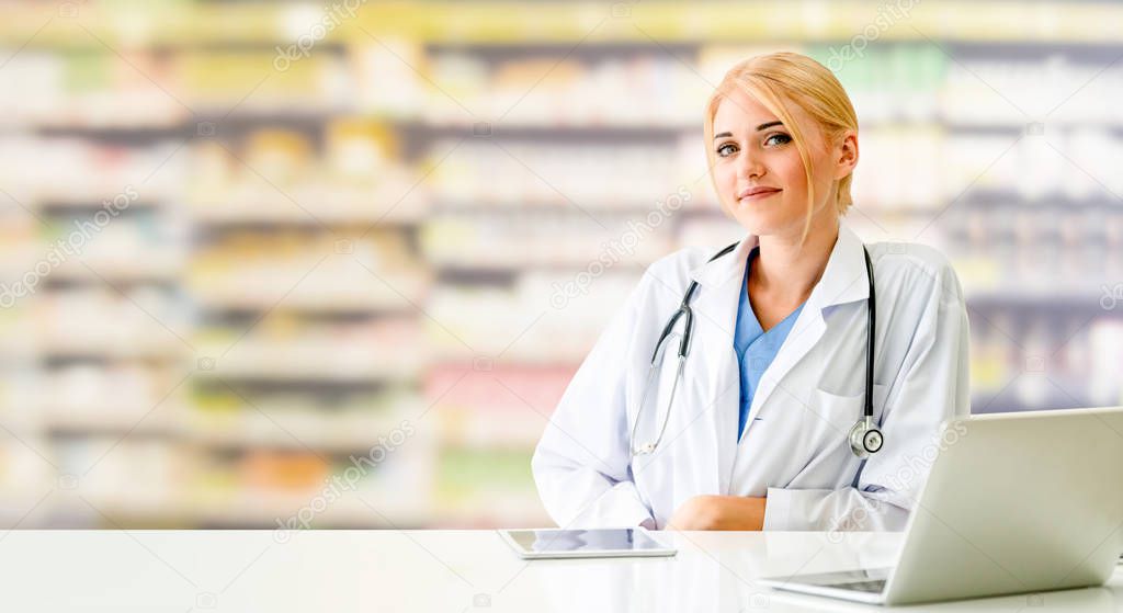 Pharmacist or doctor using laptop computer at the pharmacy room. Medical healthcare and pharmaceutical staff service.