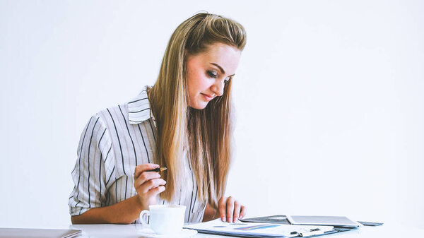 Blonde business woman working at modern office. Business concept.