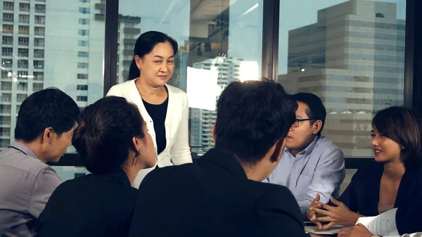 Asian business people discuss marketing strategy in group meeting at modern office. Business finance and teamwork concept.;Asian business people discuss marketing strategy in group meeting at modern office. Business finance and teamwork concept.
