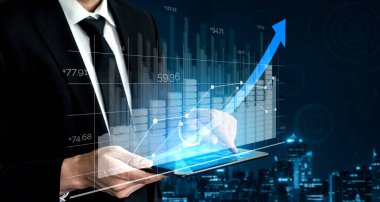 İş ve Finans 'ın Çifte Maruz Kalıbı - Raporu olan İşadamı, borsa yatırımlarının mali kar artışına doğru ilerledi.