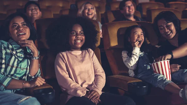 People audience watching movie in the movie theater cinema. Group recreation activity and entertainment concept.