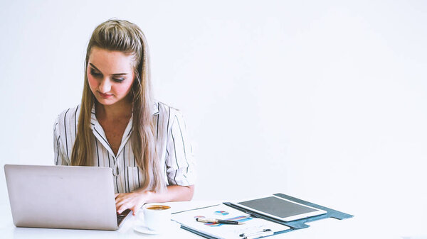 Blonde business woman working at modern office. Business concept.