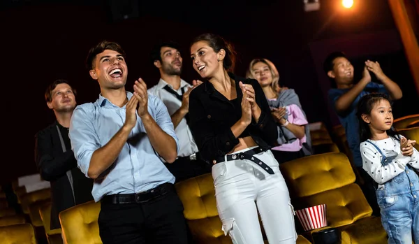 Group of audience happy and fun watch cinema in movie theater. Group recreation activity and entertainment concept.