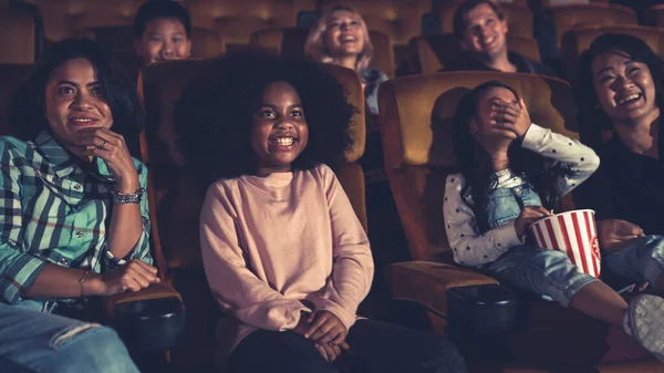 People audience watching movie in the movie theater cinema. Group recreation activity and entertainment concept.