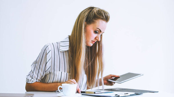 Blonde business woman working at modern office. Business concept.