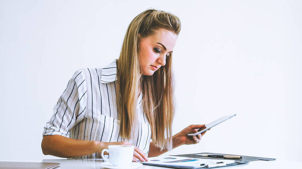 Blonde business woman working at modern office. Business concept.