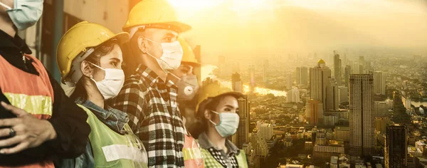 Factory workers with face mask protect from outbreak of Corona Virus Disease 2019 or COVID-19.