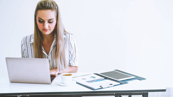 Blonde business woman working at modern office. Business concept.