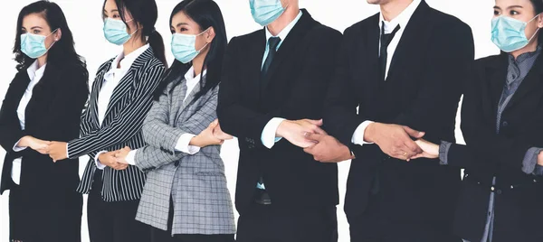 Confident business people with face mask protect from Coronavirus or COVID-19. Concept of help, support and collaboration together to overcome epidemic of Coronavirus or COVID-19 to reopen business.