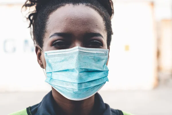 Factory workers with face mask protect from outbreak of Coronavirus Disease 2019 or COVID-19. Concept of protective action and quarantine to stop spreading of Coronavirus Disease 2019 or COVID-19.