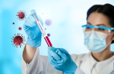 Coronavirus COVID 19 tıbbi test aşısı araştırma ve geliştirme konsepti. COVID-19 için ilaç tedavisi üretmek üzere Coronavirus antikor bilimsel örneklerini inceleyen ve analiz eden bilim insanları.